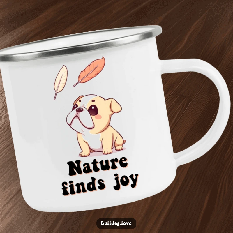 Funny bulldog camping mug, gazing adoringly at a floating feather, radiating peaceful wonder, perfect for nature lovers.