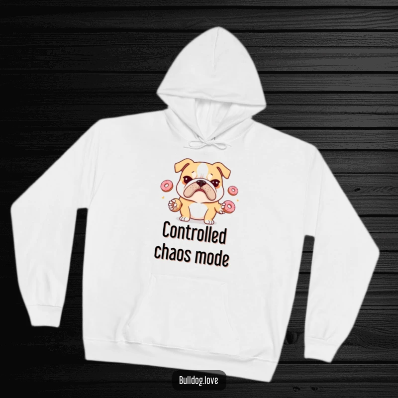 Funny bulldog hoodie portraying a stressed bulldog with a furrowed brow attempting to juggle tiny donuts, offering cozy relatability.