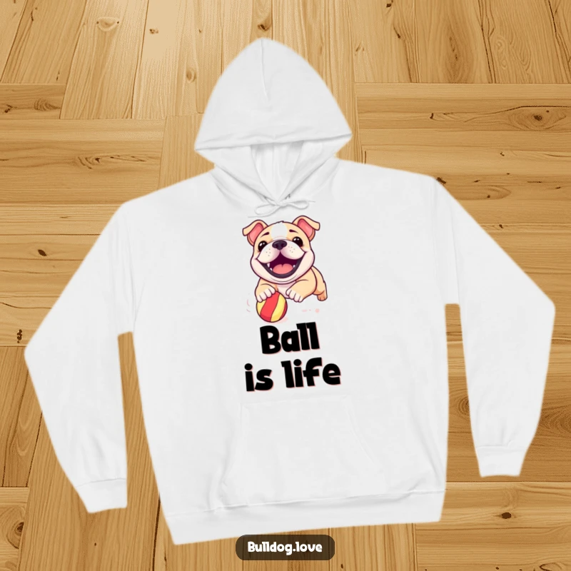 Funny bulldog pup hoodie featuring a happy, grinning dog in pursuit of a bouncy ball, radiating infectious energy.