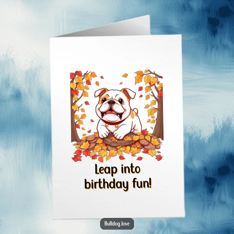 Funny Free Printable Birthday Card: A happy bulldog playfully pouncing into a pile of rustling autumn leaves with great enthusiasm.